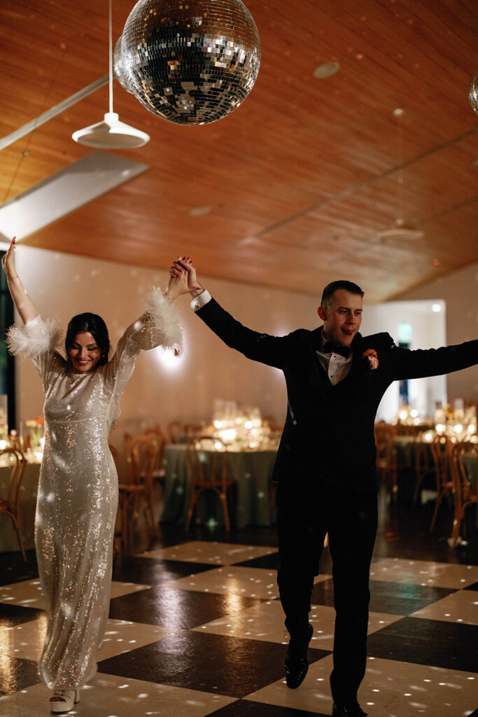 Candid wedding portrait of couple laughing during reception in Austin Texas