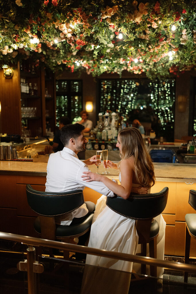 Wedding reception inside the Four Seasons Austin ballroom with soaring ceilings and elegant decor