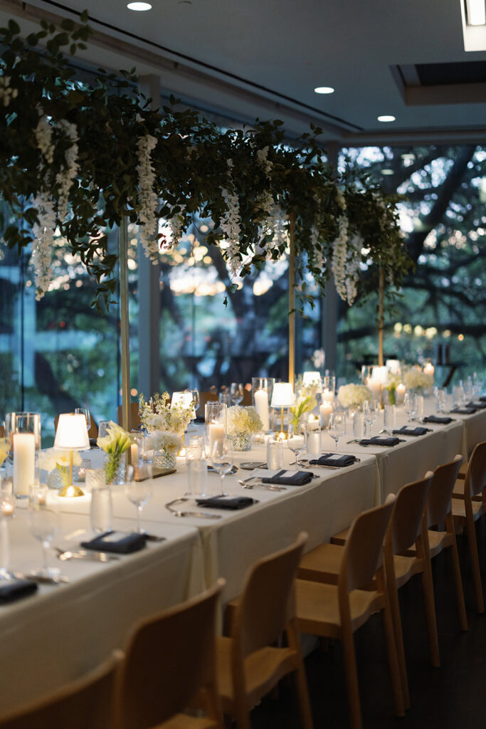 Wedding ceremony in the Topaz Ballroom at LINE Austin with floor-to-ceiling windows overlooking Lady Bird Lake