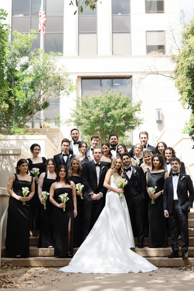 Outdoor wedding ceremony on the back lawn at Four Seasons Austin with Lady Bird Lake in the background