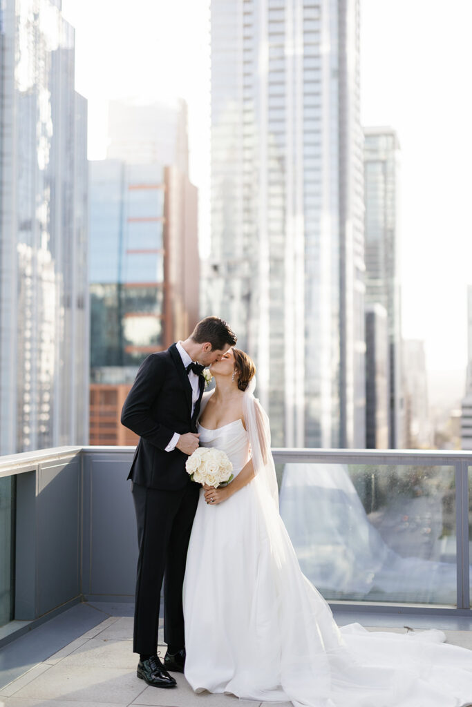Golden hour wedding portraits on the rooftop terrace at Thompson Austin with the Austin skyline in the background