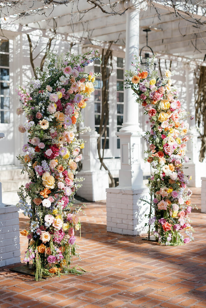 Outdoor wedding ceremony under oak trees at Woodbine Mansion in Round Rock Texas