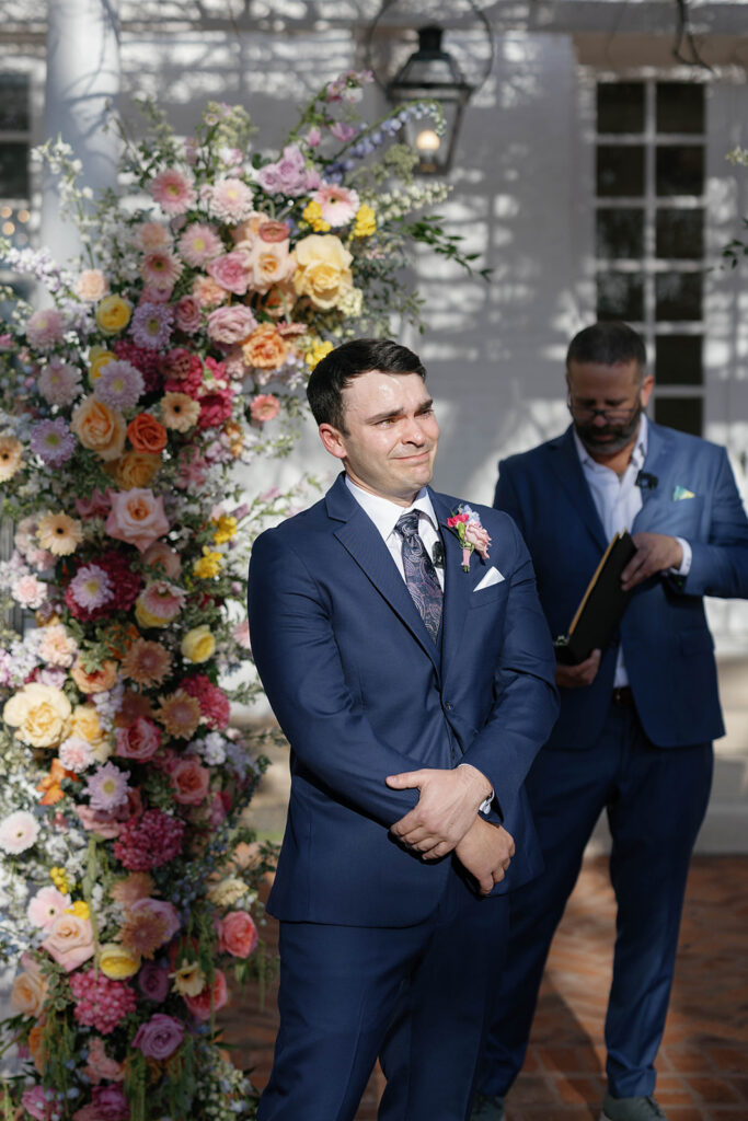 Outdoor wedding ceremony under oak trees at Woodbine Mansion in Round Rock Texas
