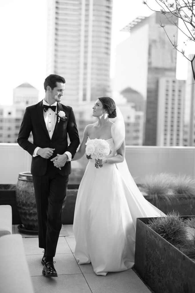 Golden hour wedding portraits on the rooftop terrace at Thompson Austin with the Austin skyline in the background
