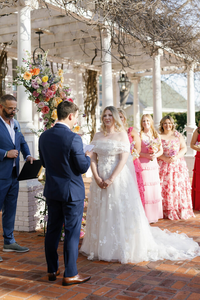 Bride and groom exchanging vows at Woodbine Mansion wedding