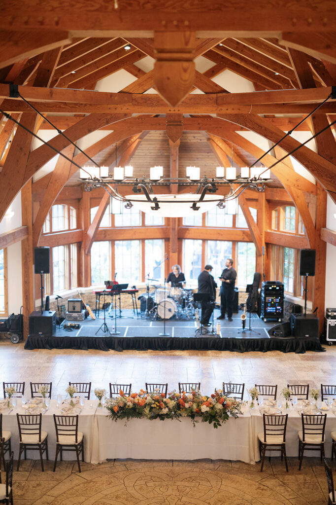 Timber framed Great Hall interior set for wedding reception at Camp Lucy, Texas Hill Country