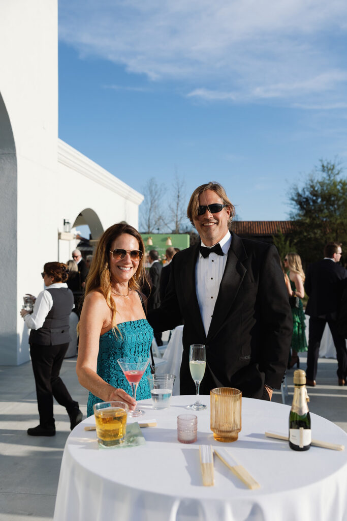 Guests mingling during cocktail hour at Texas Hill Country wedding