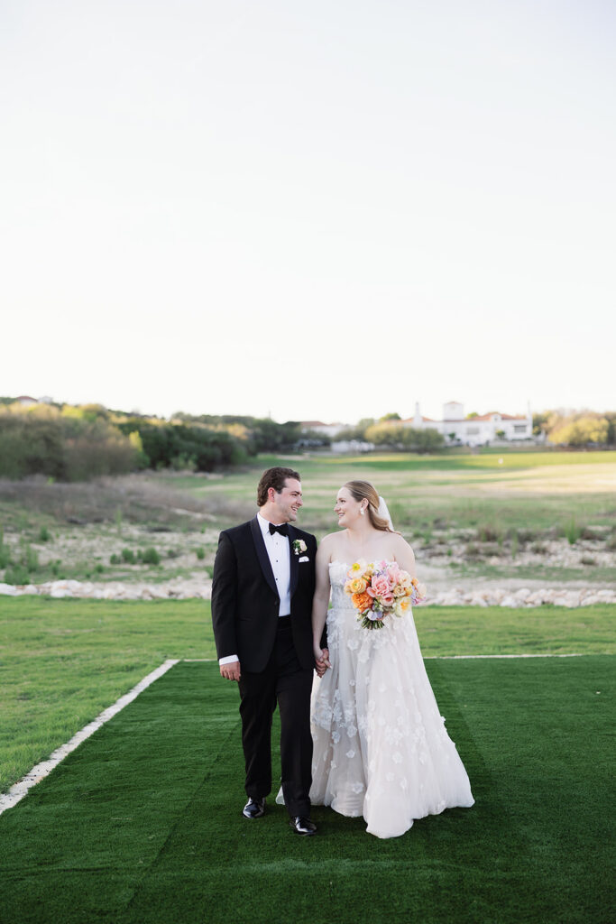Bride and groom portrait against Texas Hill Country landscape at La Cantera Resort & Spa
