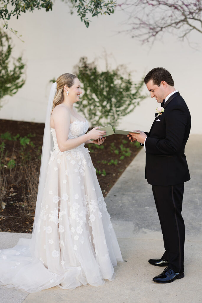 Bride and groom exchanging vows outdoors at Texas Hill Country wedding