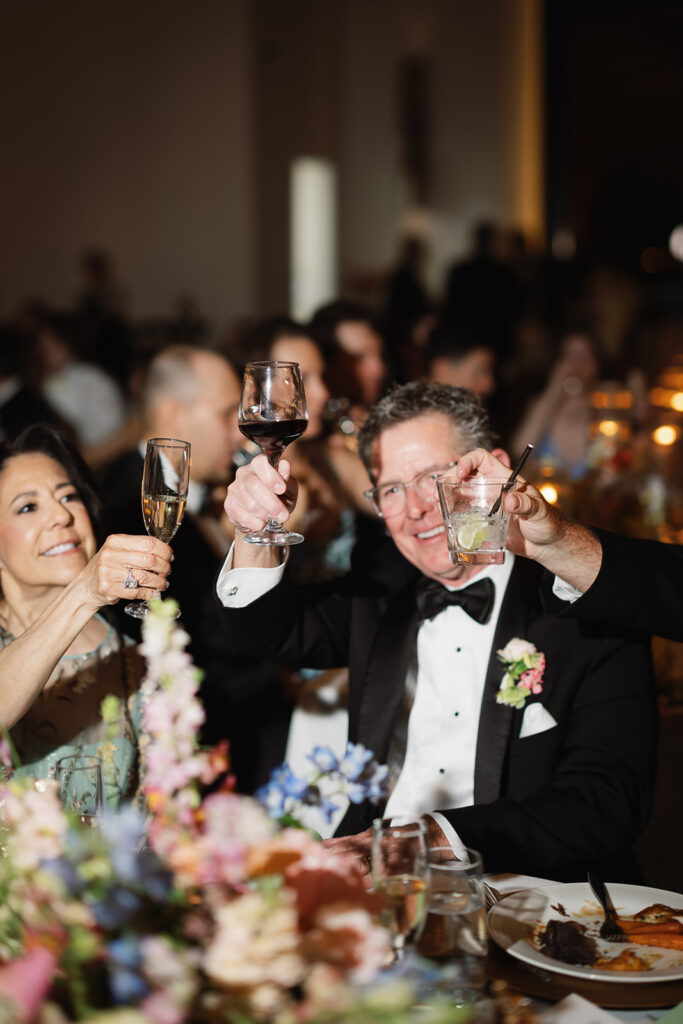 Guests raising a toast at Texas Hill Country wedding reception