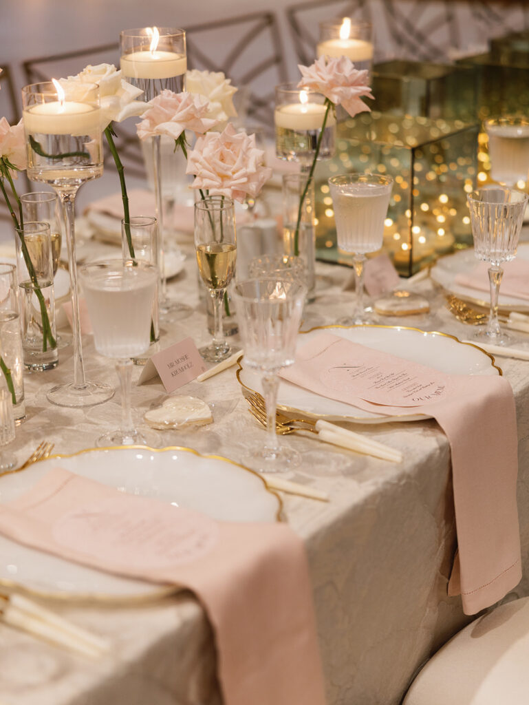 Cream and blush ballroom reception with candlelight at a Texas Hill Country wedding