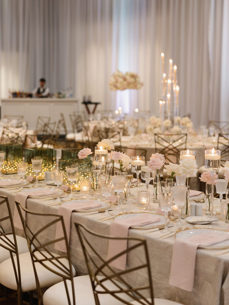 Cream and blush ballroom reception with candlelight at a Texas Hill Country wedding