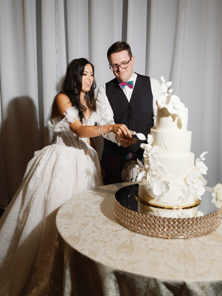 Cake cutting moment at a Signia by Hilton wedding reception