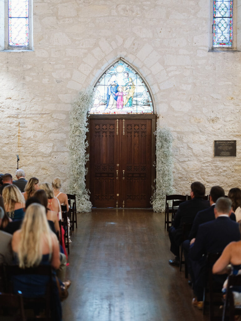 Sunlight through the windows of Coates Chapel during San Antonio wedding ceremony