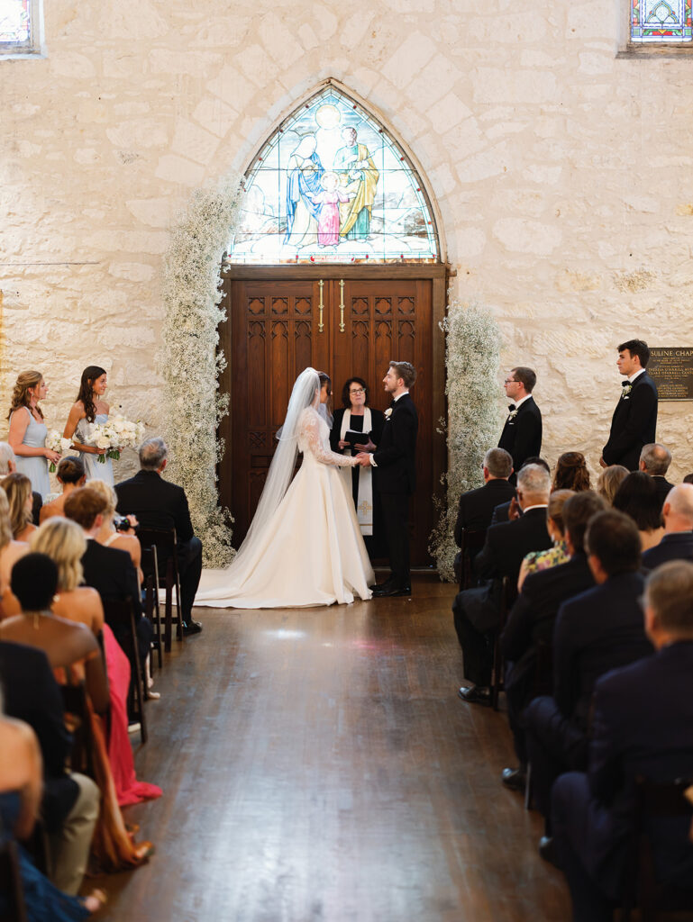 Wedding ceremony inside historic Coates Chapel at Southwest School of Art