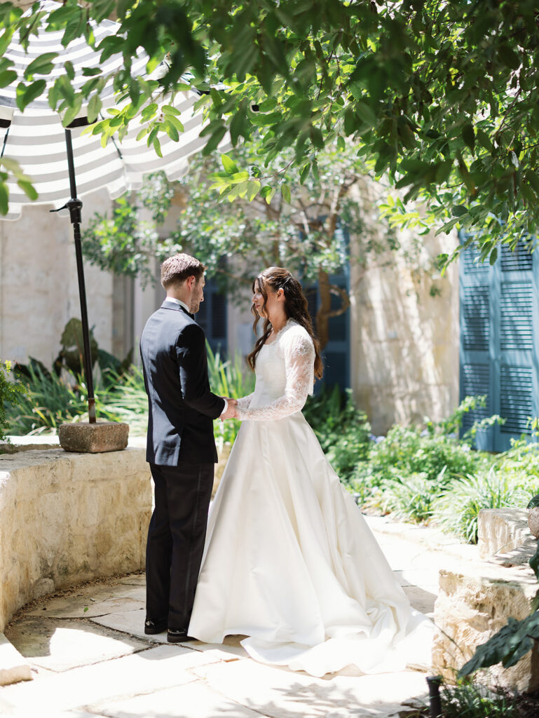 Bride and groom first look at Southwest School of Art wedding