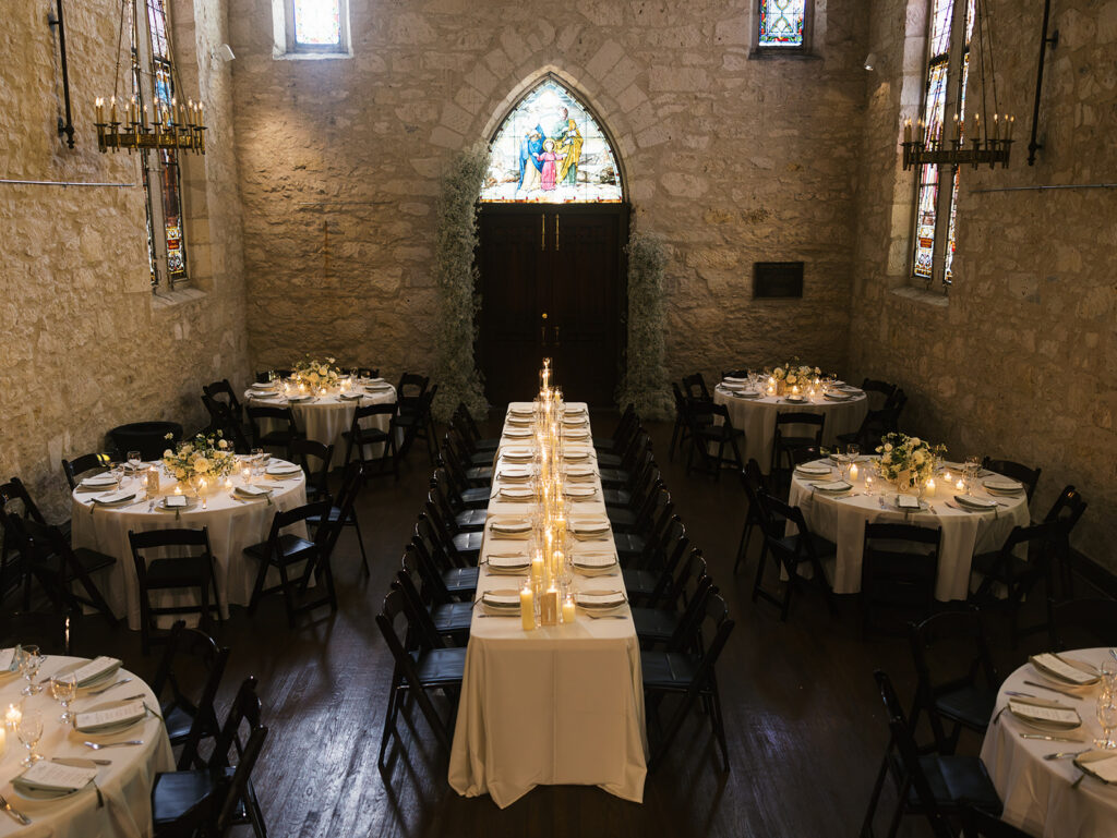 Moody candlelit tablescape at San Antonio wedding reception