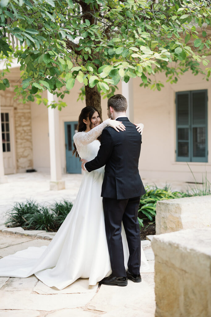 Bride and groom first look at Southwest School of Art wedding