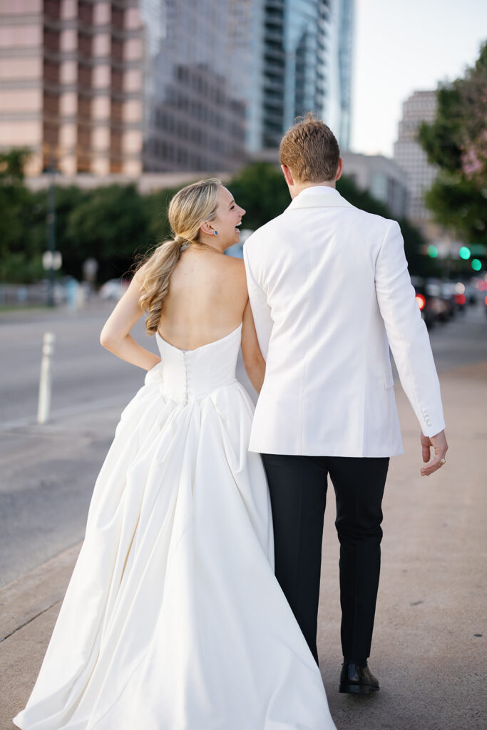Newlyweds walking through downtown Austin after their Line Hotel wedding