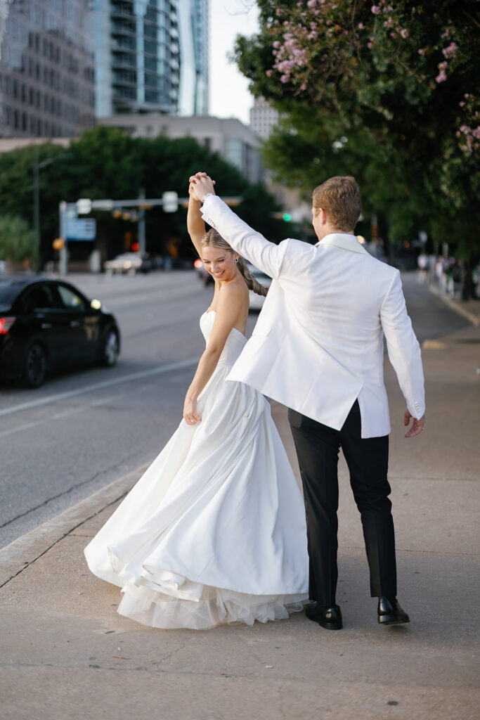 Newlyweds walking through downtown Austin after their Line Hotel wedding