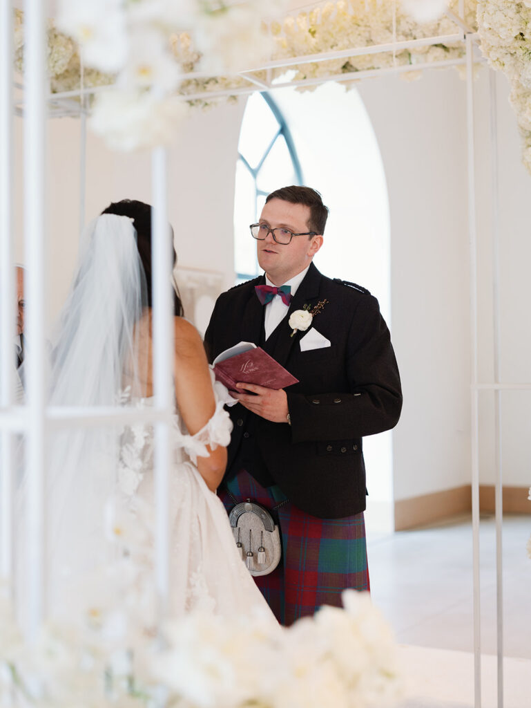 Ashley and Nathan exchanging vows at their Signia by Hilton wedding