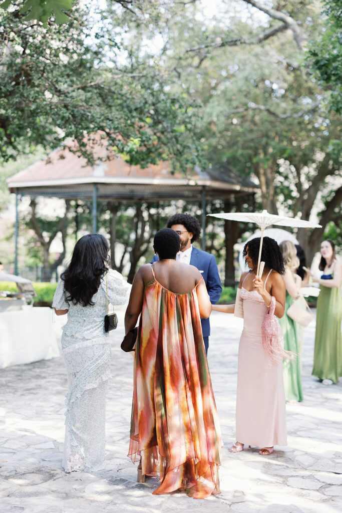 Guests catching up during cocktail hour at San Antonio wedding reception
