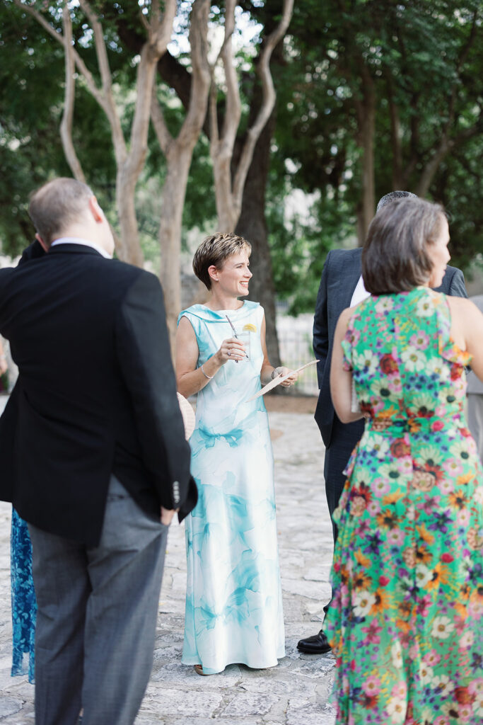 Guests catching up during cocktail hour at San Antonio wedding reception